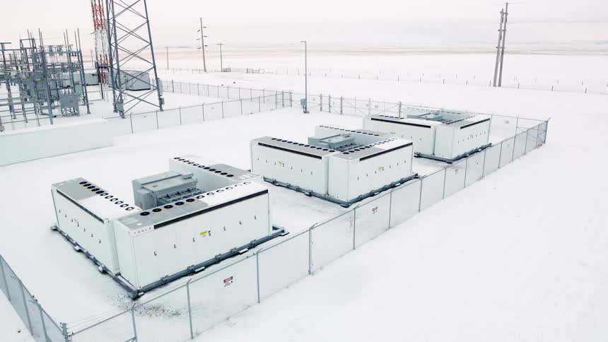 Aerial view of battery energy storage cabinets in the snow