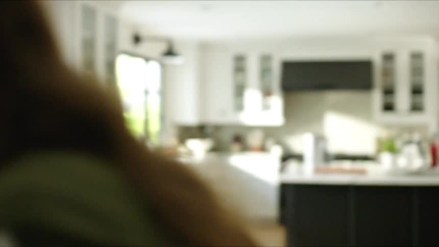 A clip of a lady in her home