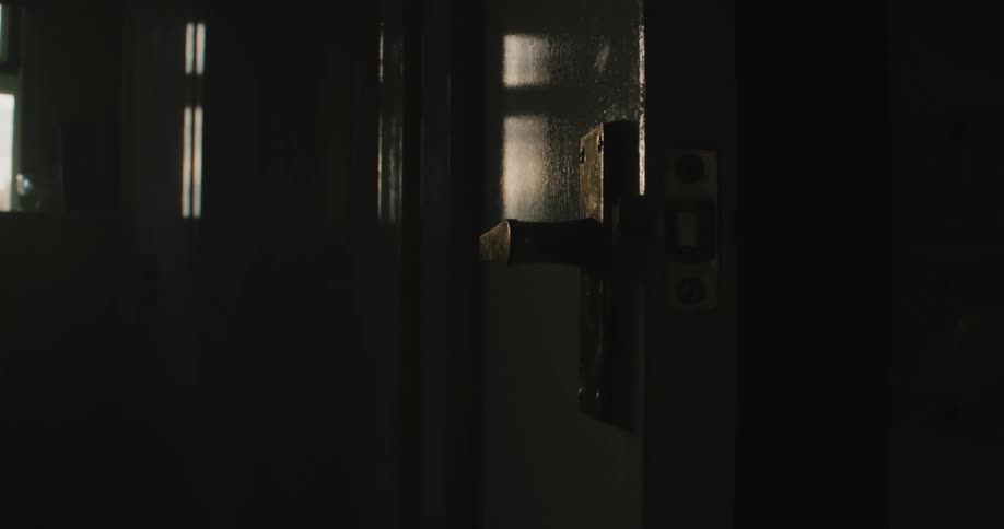 Closeup of a door inside a house with sunlight