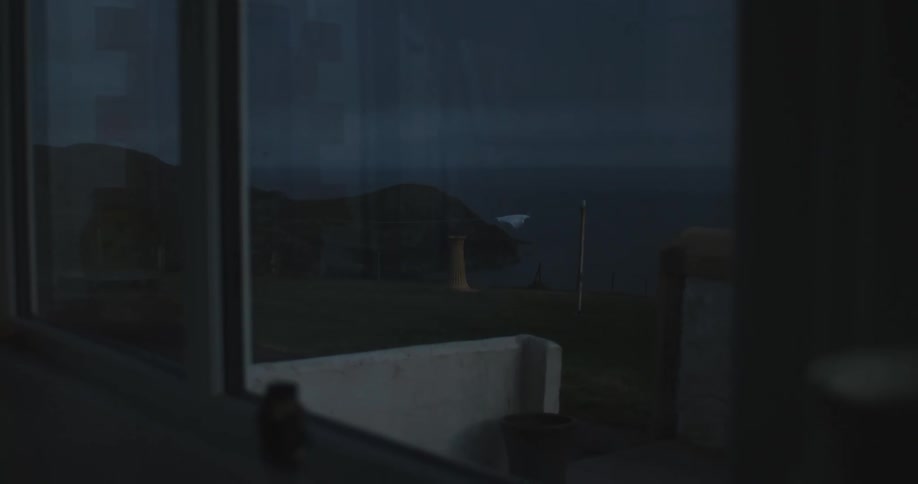 Clothes on a clothesline swinging against the wind during dusk