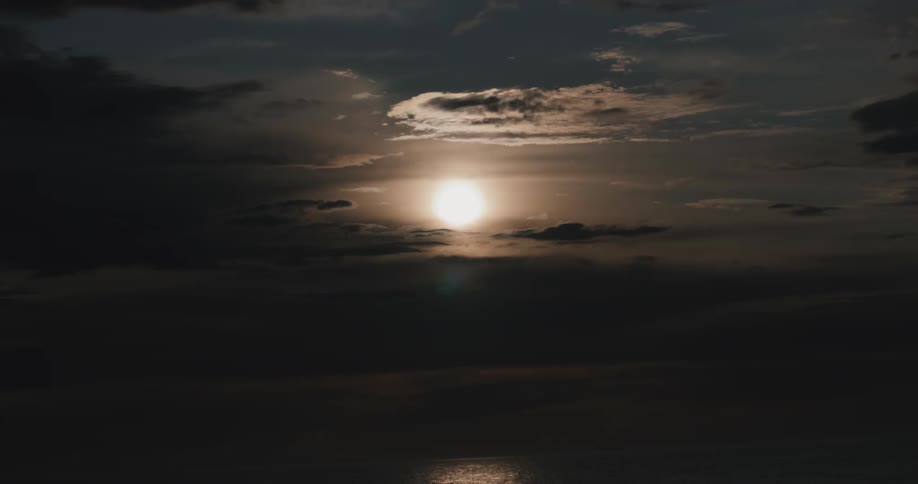 Landscape of the sun on the horizon reflecting on the sea in a morning