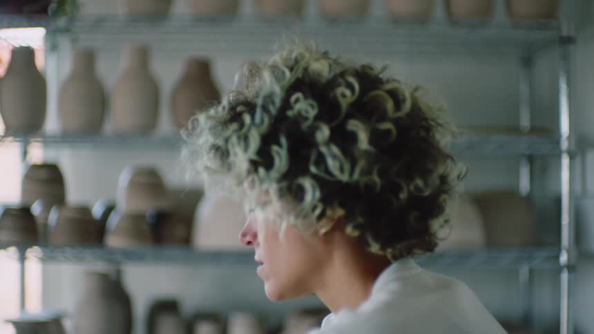Portrait of a young woman indoors working