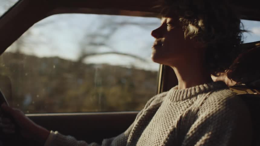 A lady driving a car