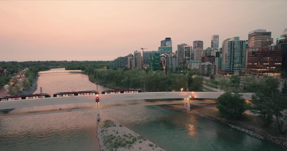 A train crosses the Bow River at dawn in Calgary