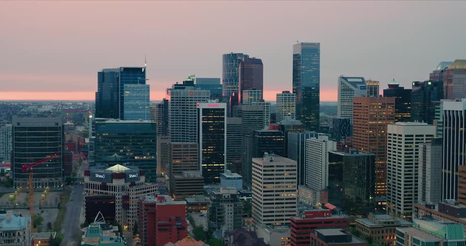 Aerial clip of city skyscrapers in Calgary at dawn