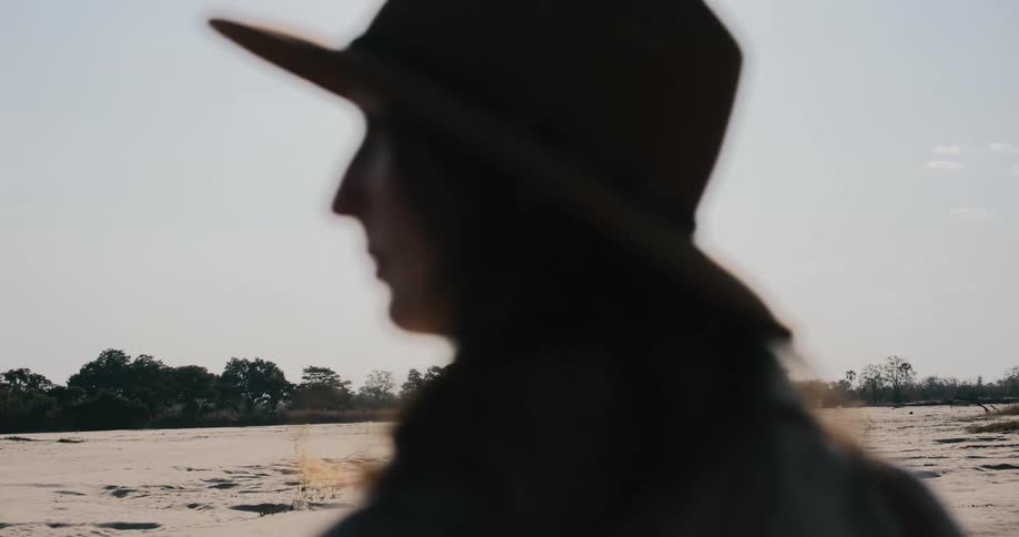 A woman admiring a safari on a sunny day