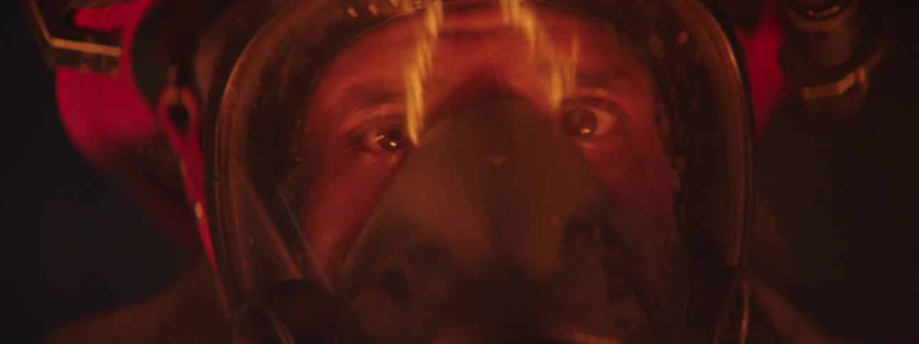 Closeup of a firefighters face wearing a respirator mask