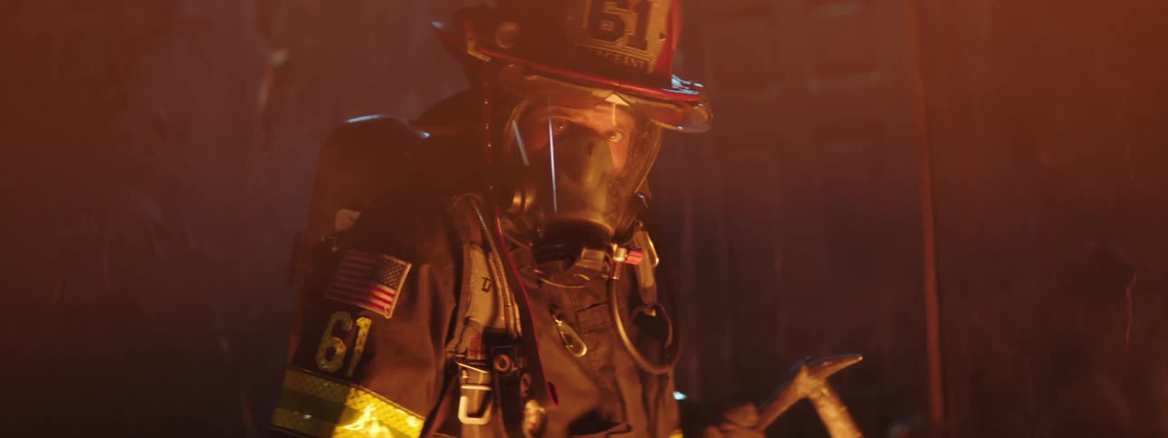 A firefighter in a building that is on fire