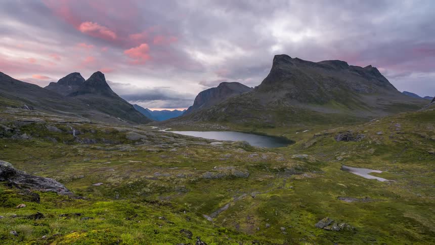 A stream runs past the mountains