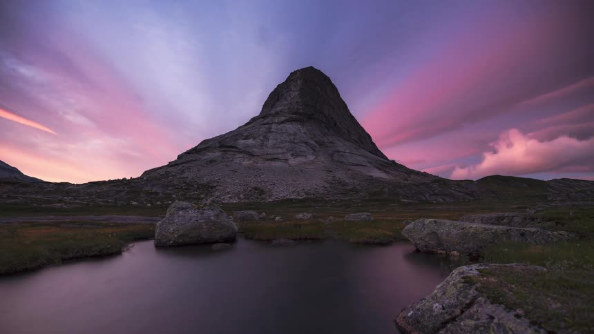 A time lapse of a mountain reveals a beautiful transition from night to day