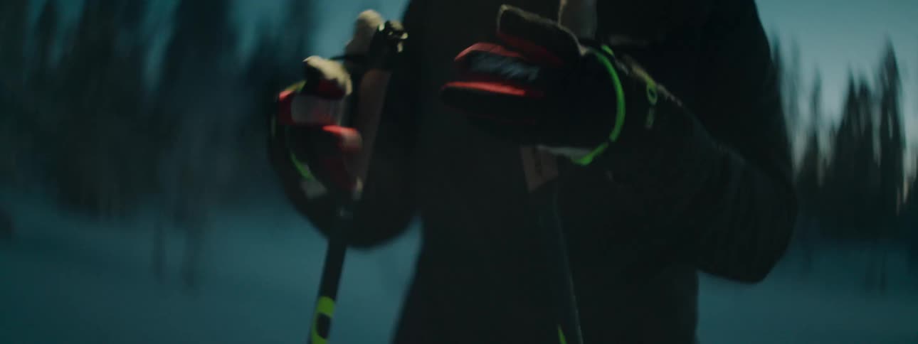 A woman is putting on her gloves