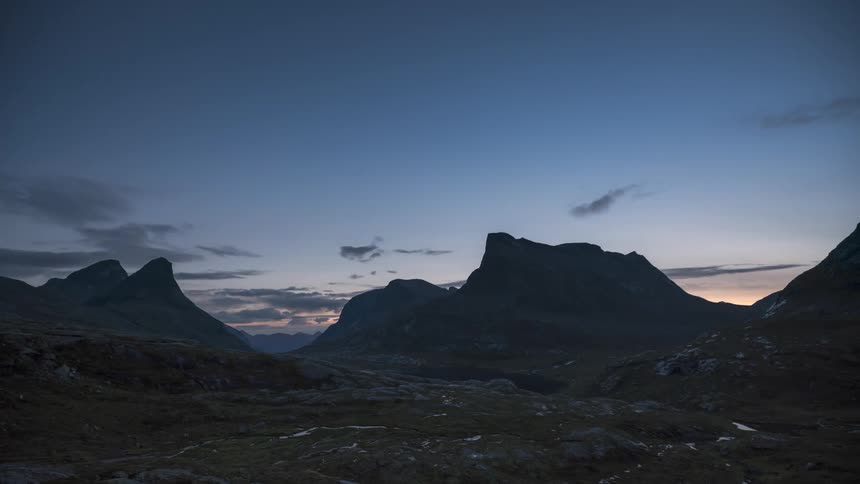 Timelapse landscape of the day dawning amidst the mountains