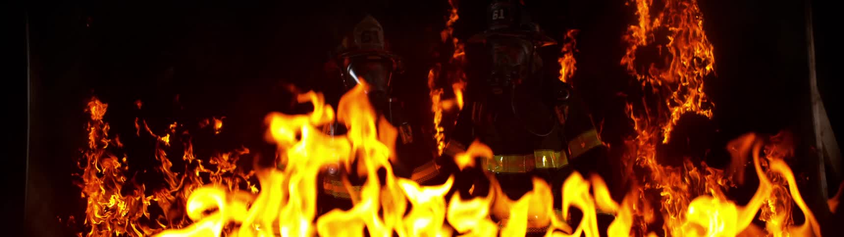 Firefighters in the midst of a blazing fire
