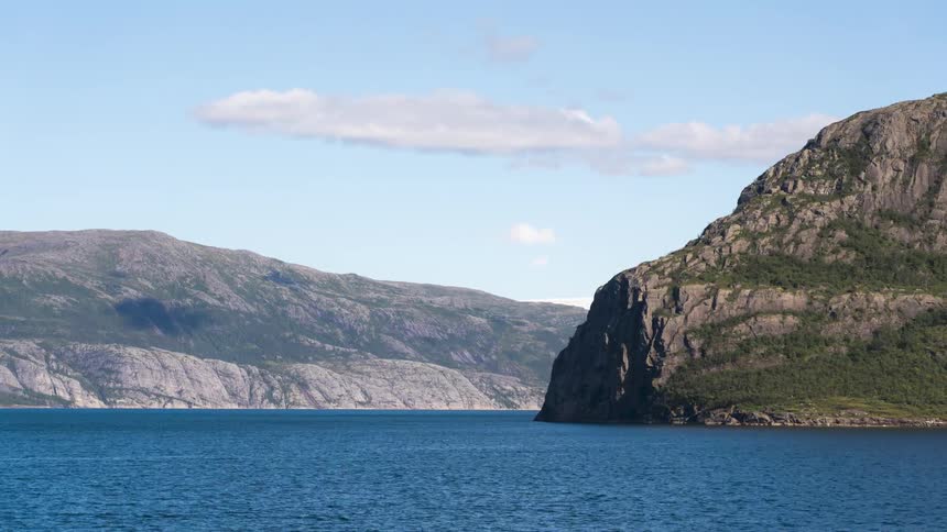 Mountains surround a body of water