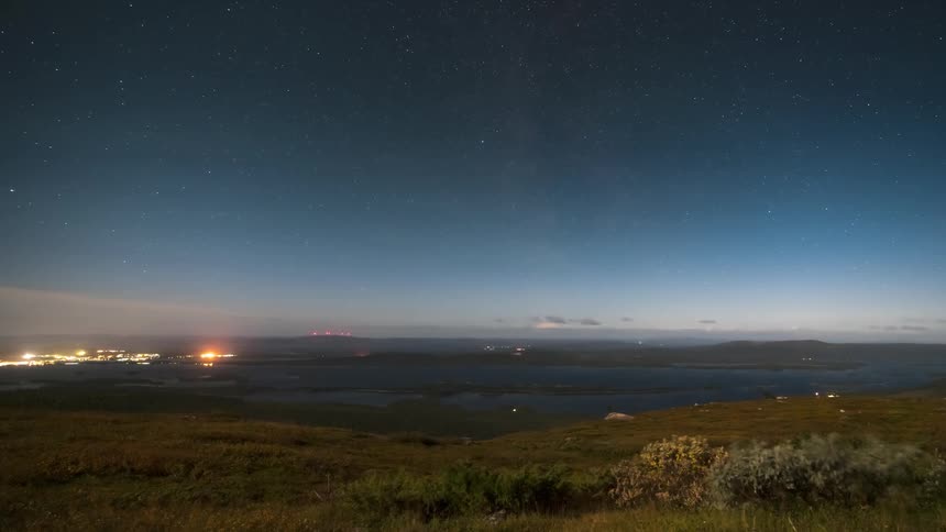 Timelapse landscape and mountains than the sea with a darkening day
