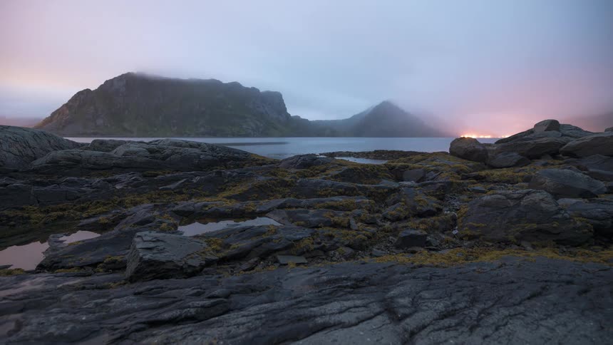 Time lapse of the tide on a rocky shore going up and down through the day