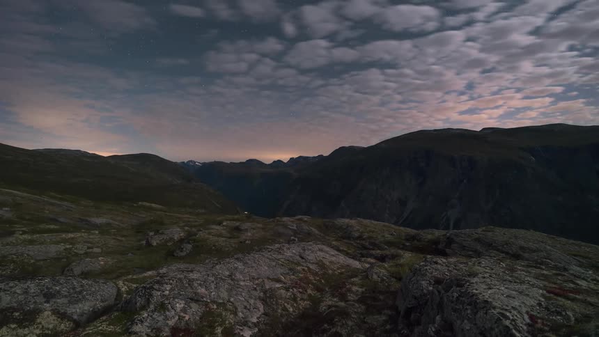 A rocky terrain under a cloudy sky