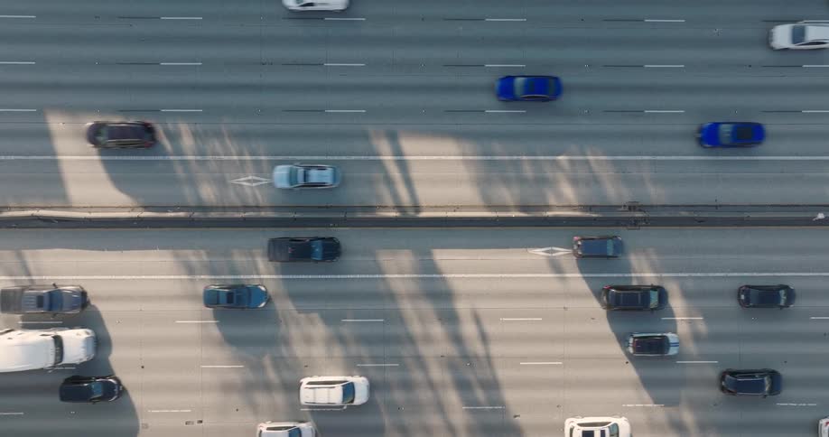 Slow ascent over commuter traffic on a ten lane expressway