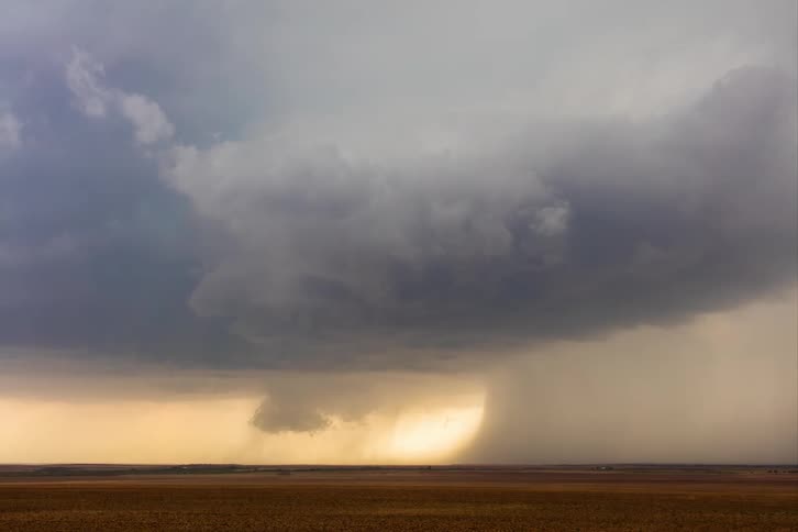 A storm of violent winds in a rural field