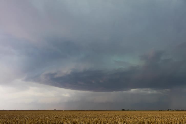 Lightning strikes in the cloudy sky at daytime