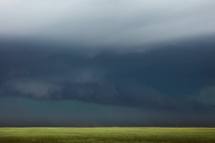 A large storm passes by the field