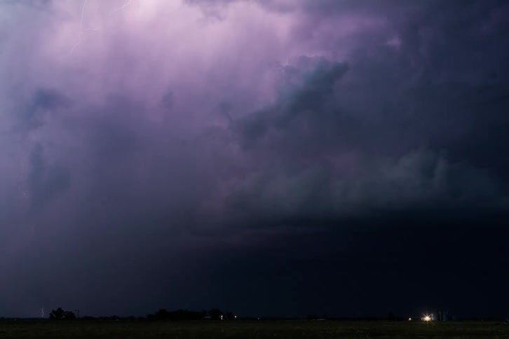 As storm clouds gather ominously overhead lightning streaks across the darkened sky heralding the imminent arrival of a powerful hurricane