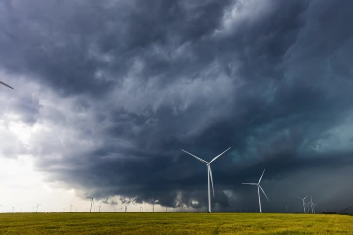 Storm clouds gather above the wind farm