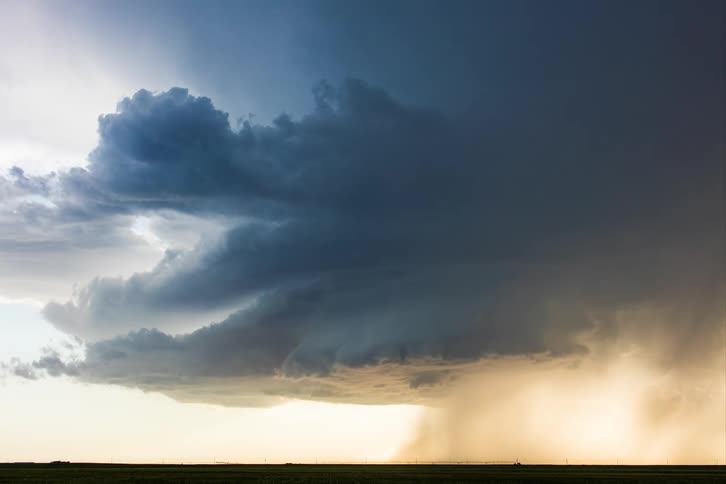 A hurricane approaches a rural field at sunseta hurricane approaches a rural field at sunseta hurricane approaches a rural field at sunseta hurricane approaches a rural field at sunseta hurricane approaches a rural field at sunset