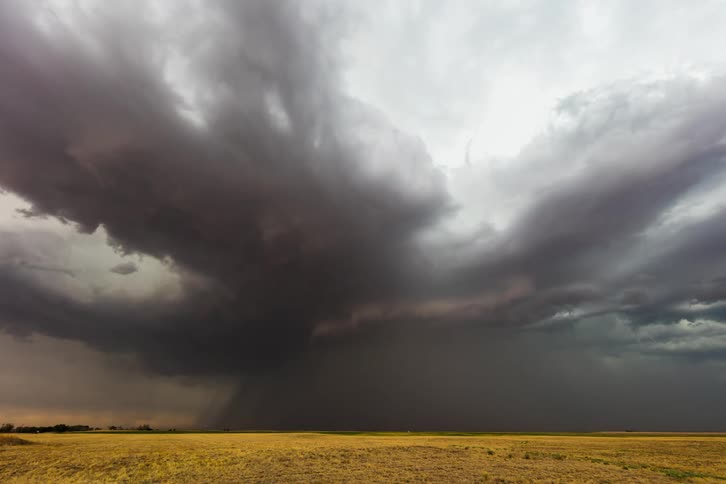 Time lapse of clouds swirling and storm forming over flat plains land
