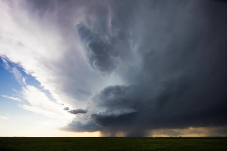 Storm clouds move across the sky as a super cell moves over the ground