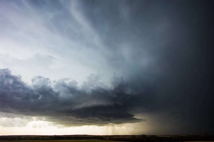 A cyclone in the countryside during sunset