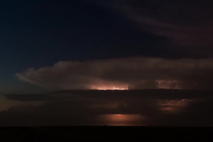 Night sky with lightning storm and black clouds