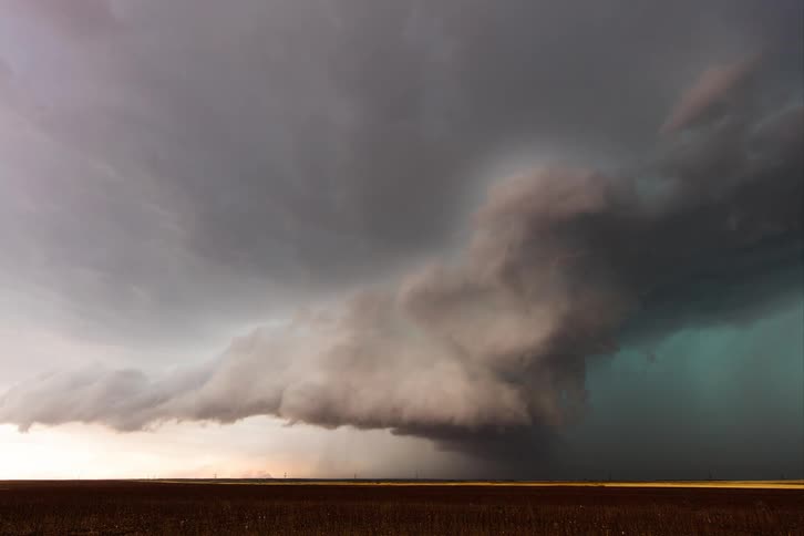 Time lapse of a tornado rolling across a field