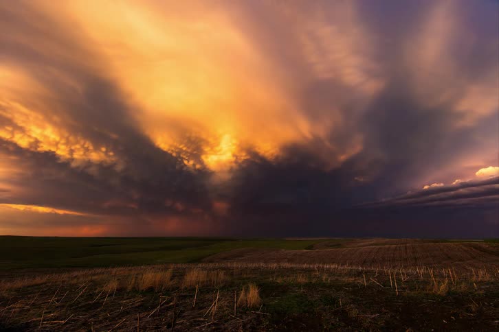 Dark clouds accumulated in a meadow in the countryside