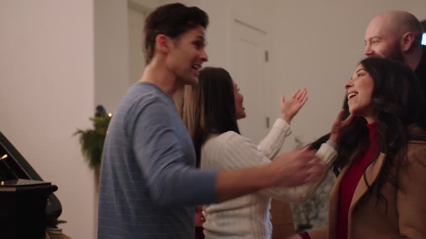 Happy family greeting each other at christmas time