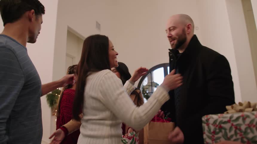 Family greeting each other indoors during the festive season