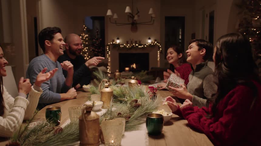 A clip of friends laughing and having conversations on the table