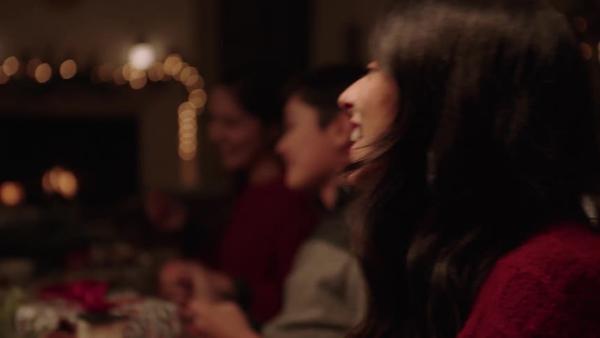 A woman talking animatedly with other people