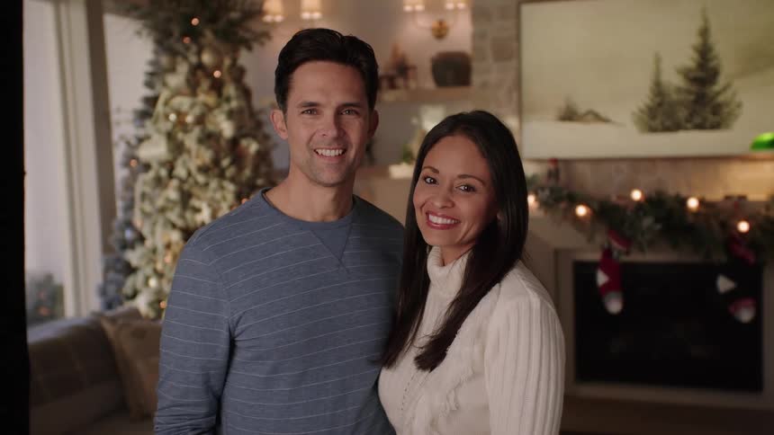 Portrait of a smiling couple standing in the room