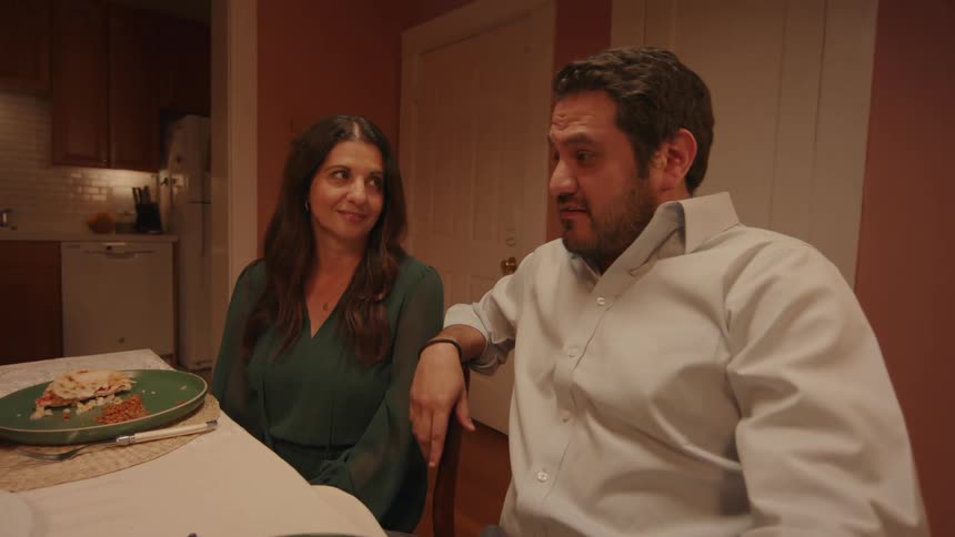 People talking around the dinner table
