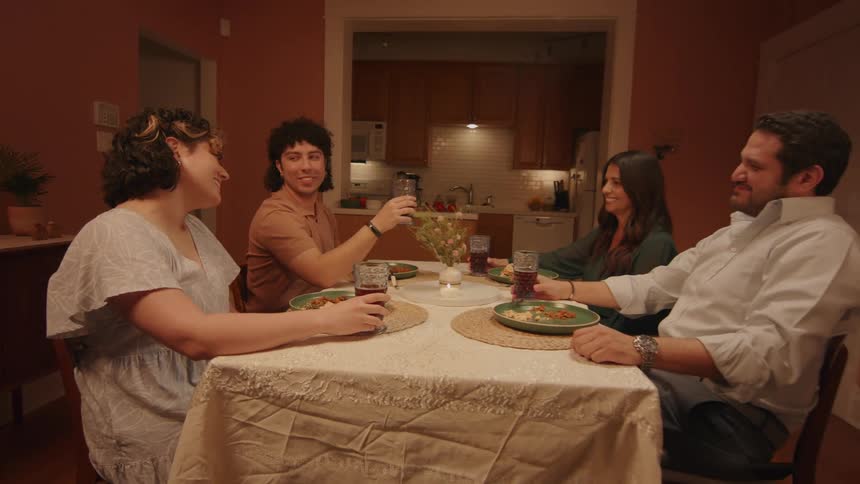 People toasting during a family dinner
