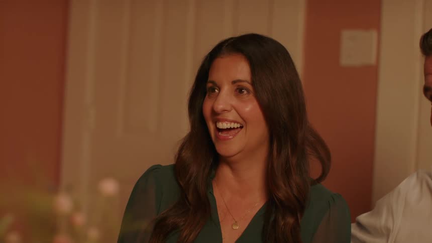 A man and woman laugh together