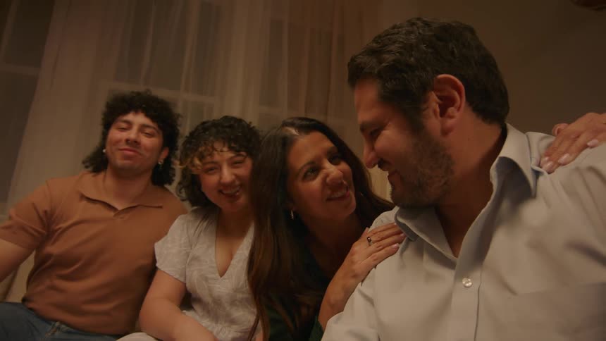 Family looking at cellphone photo together and approving