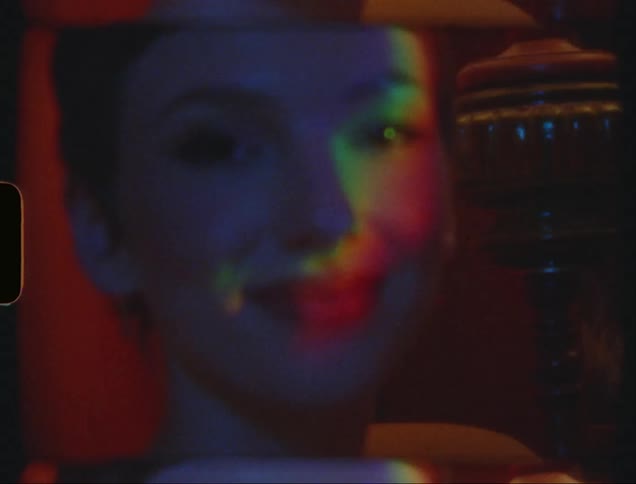 A woman smiles in the room