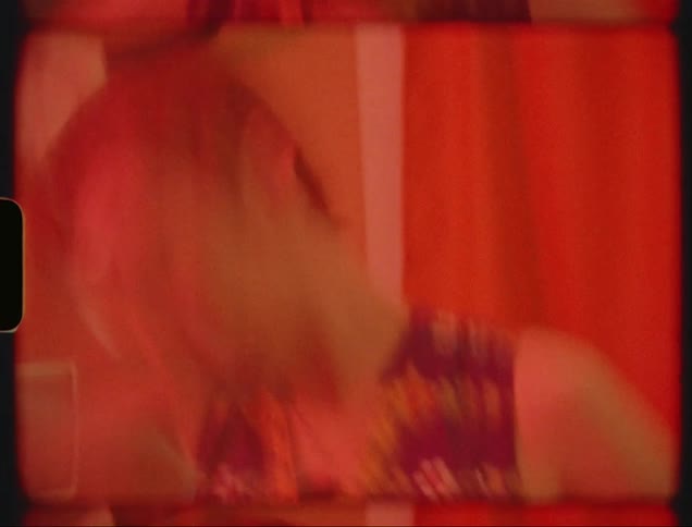 Portrait of a young woman indoors dancing