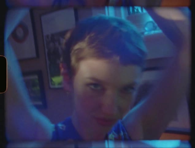 Closeup of a womans face dancing at home