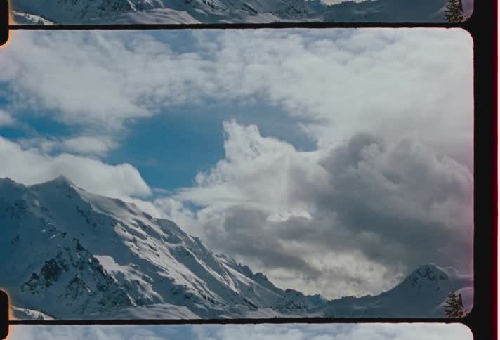 A snow mountain range on a sunny winter day