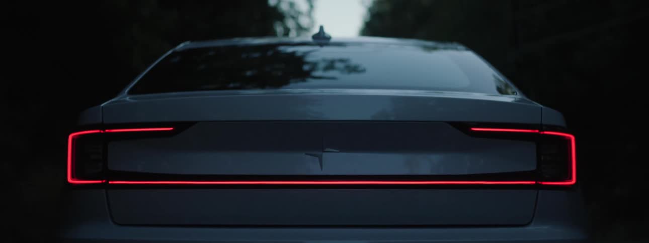 A back view of a moving Polestar Electric Vehicle
