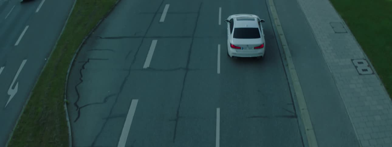 Cars drive down a road