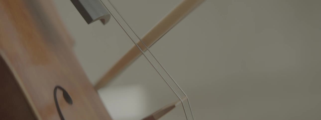 Musician manipulates bow over string instrument